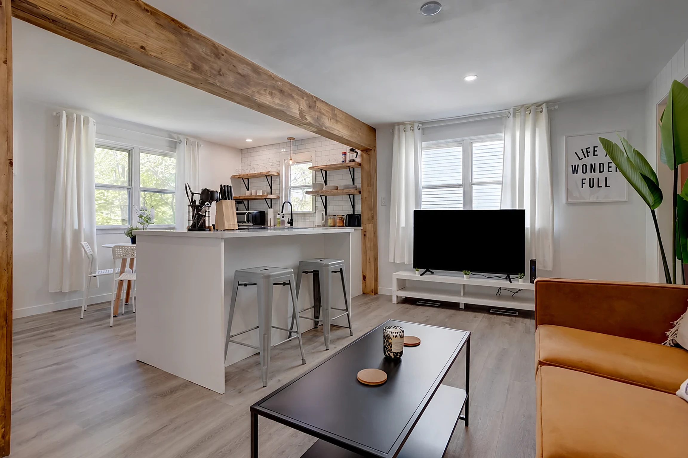Bright open-concept kitchen and living room in a well-kept rental home